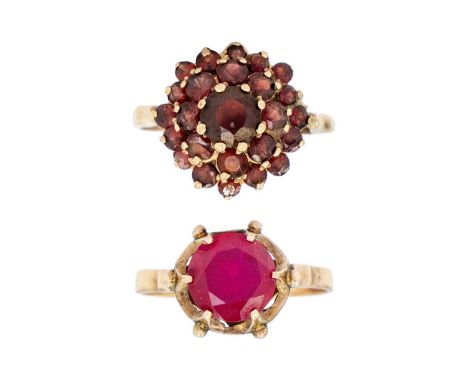 A 14ct synthetic ruby dress ring and a 9ct garnet cluster ring. The ruby ring stamped 14 to the outer shank, size S, 3.0g; th