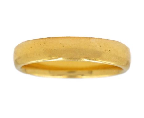 A 22ct band ring. D-section, hallmarked Birmingham 1928, size K 1/2, 5.6g.