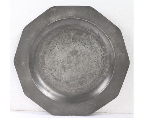 A rare and documented George II pewter decagonal dish, circa 1750The ten-sided plain rim engraved with a crest device - an ar