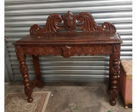 Late Victorian oak hall/console table, with profusely carved Gothic detail, 114cm in width, 43cm in depth. 