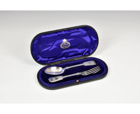 A cased Edwardian silver fiddle pattern bright cut spoon and fork set, in a leather case with fitted blue velvet and silk int