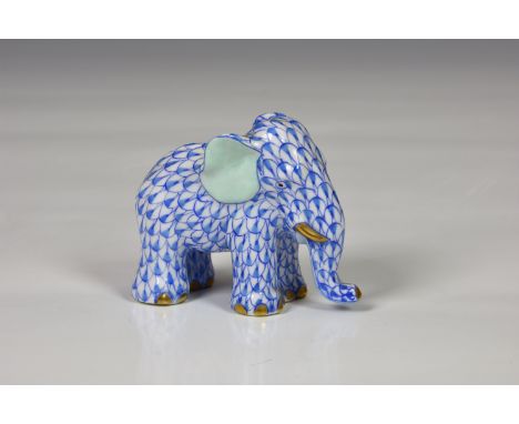 A Herend porcelain Elephant, hand painted in Vieux Herend (VHB) blue fish scale design, gilt highlights, light blue ears, blu