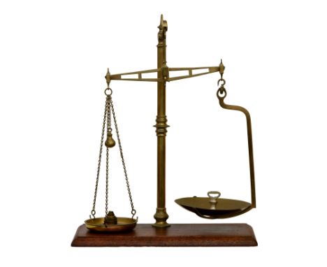 A set of brass Victorian shop scales by Parnall and Sons, with weights, mounted on chamfered wooden base, 31¾in. (80.6cm.) hi