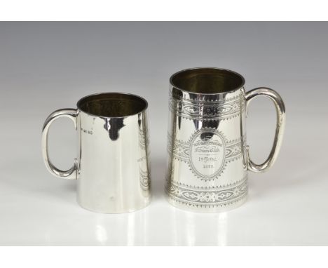 A Victorian silver presentation tankard, Thomas Smily, London 1873, of tapering cylindrical form, loop handle, engraved decor