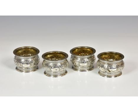 A set of four George III silver open salts, Robert Hennel I & Samuel Hennel, London 1804, of bun / cauldron form with floral 