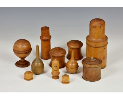 Treen - a group of turned boxwood containers, comprising a 19th century cylindrical container housing a glass apothecary jar,