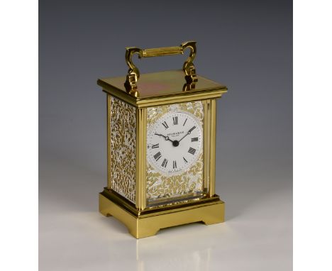 A Taylor and Bligh brass cased carriage clock, quartz movement, the single bevelled glass fronting the white Roman dial withi