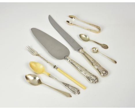 A small collection of silver and white metal cutlery, comprising a bone handled pickle fork; a silver mounted bone teaspoon; 