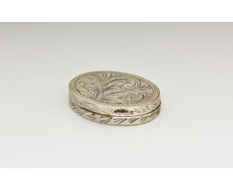 A Continental silver patch box, 19th / early 20th century, oval with chased foliate decoration and wrigglework border, 1¾in. 
