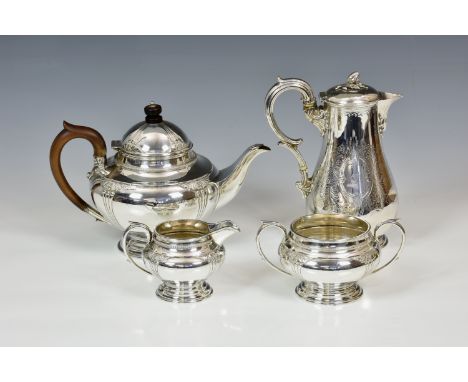 A George V silver three piece tea service, James Deakin & Sons, Sheffield 1930, of bun form with foliate comb decoration, lea