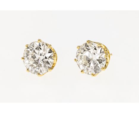 An impressive pair of diamond earstuds, each set with an old brilliant cut diamond weighing approximately 4.0ct (total approx