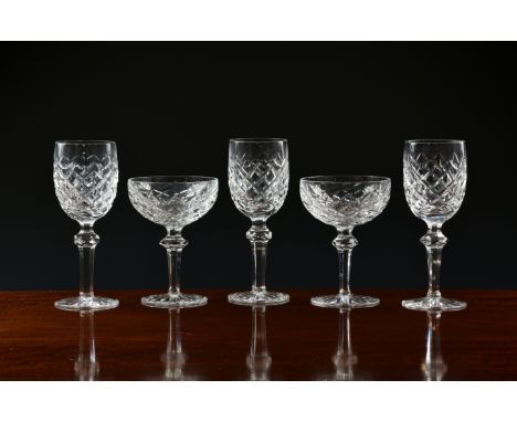 A part suite of Waterford Powerscourt pattern glasses, comprising nine 18cm. red wine glasses and eight 13.75cm. champagne sa