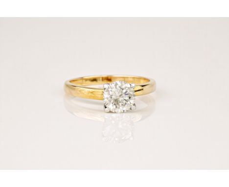 A diamond solitaire ring, the round cut diamond weighing approximately 1ct and set in a 9ct yellow gold band. Ring size M. * 