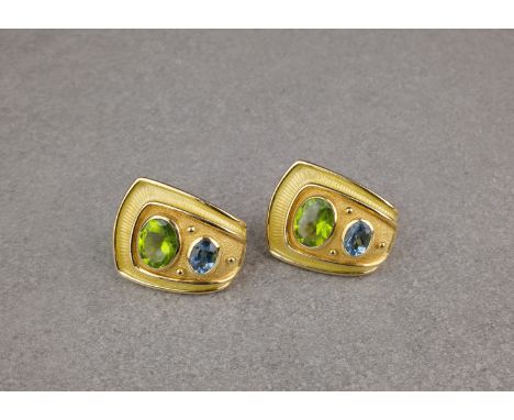 A pair of 18ct gold, peridot and topaz ear clips, by Leo de Vroomen, each asymmetrical rectangular plaque with a horizontal, 