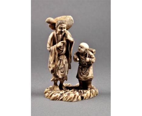 A Chinese carved ivory figure of a traveller, Qing Dynasty, the emaciated man dressed in robes, with a large lotus leaf and b