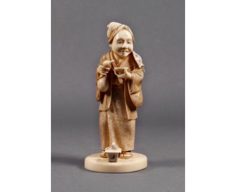 A finely carved Japanese ivory okimono of an inebriated lady, Meiji period (1868-1912), holding a gourd bottle in one hand an