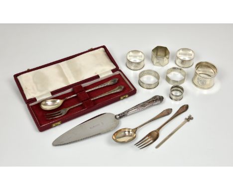 Four silver napkin rings, plus three plated examples; a cased silver pickle fork and spoon; a christening fork and spoon; a c