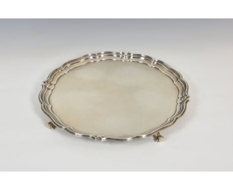 A George VI silver salver, Harrison Brothers &amp; Howson, Sheffield 1950, circular form with moulded stepped shaped rim, no 