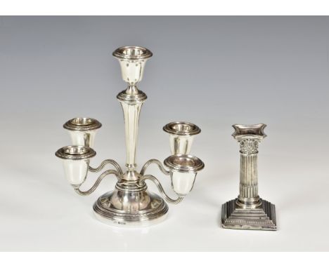 An Elizabeth II silver five light table candelabra, Elkington &amp; Co., Birm. 1966, with foliate borders, weighted, 8¼in. (2