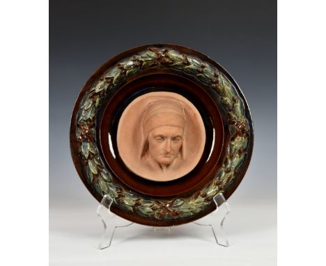 Alexander Munro (Scottish, 1825–1871), a terracotta portrait of Dante, signed with monogram AM lower left, set within a majol