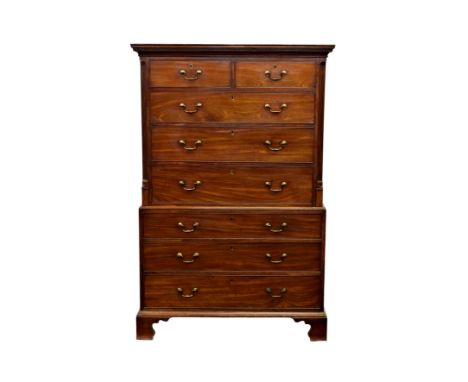 A George III mahogany chest on chest, the flared top with dentil carved cornice over two short and three long graduated cockb