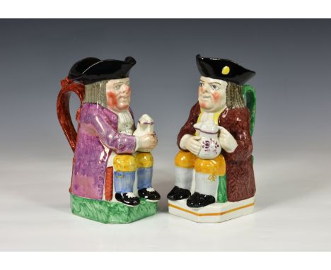 An early 19th century pink lustre toby jug, of traditional form, seated and holding a lustre decorated foaming jug in both ha