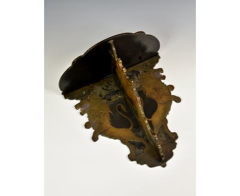 A Victorian papier-mache folding wall bracket, the shaped demi-lune shelf on a folding bracket and backplate, decorated with 