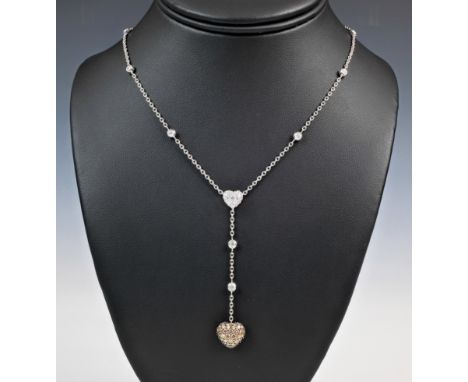 An 18ct white gold and diamond heart necklace by Chopard, featuring a pavé fancy brown diamond studded heart, suspended on a 