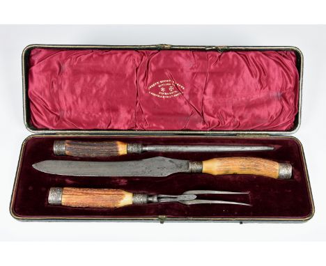 A late Victorian cased silver mounted three piece antler handled carving set, Joseph Rodgers & Sons, Sheffield 1900, the hing