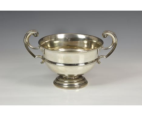 A George V silver twin handled trophy cup, James Dixon &amp; Sons Ltd., Sheffield 1923, with stepped circular base and high s