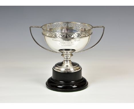 A George V silver trophy cup, Horace Woodward & Co Ltd., London 1919, with leaf capped ribbed handles, pierced trestle and fo