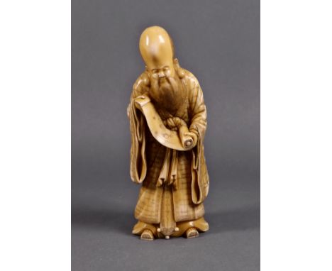 A Japanese carved ivory figure of the immortal Jurojin, Edo period, 19th century, the finely carved standing figure holding a