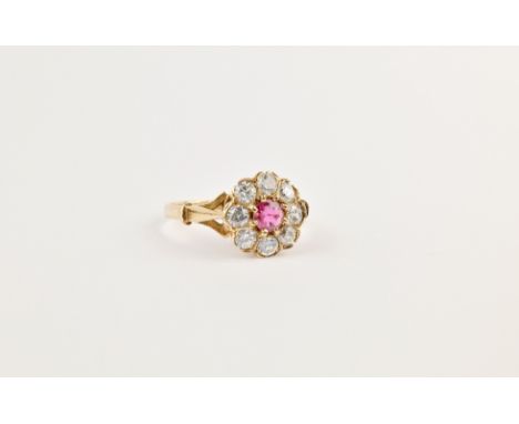 A 9ct gold, ruby and CZ cluster ring, size N. 