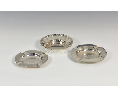 An Elizabeth II silver trinket dish, Barker Bros. Silver Ltd., Birm. 1960, of floral form, 4¼in. (10.8cm.) diameter; together