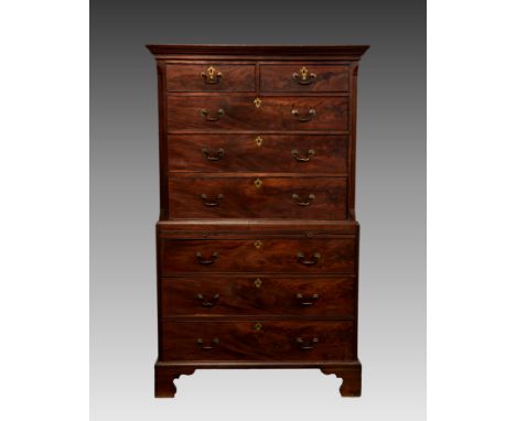 A George III mahogany chest on chest, the flared cornice over two short and three long graduated drawers within fluted, cante