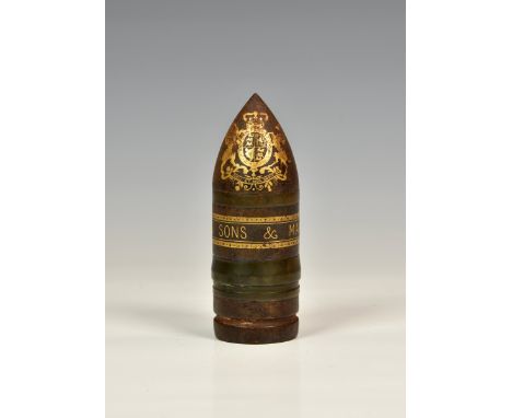An unusual 'Vickers Sons &amp; Maxim Ld' gilt decorated bullet paperweight, the bullet decorated with gilded Royal crest to t