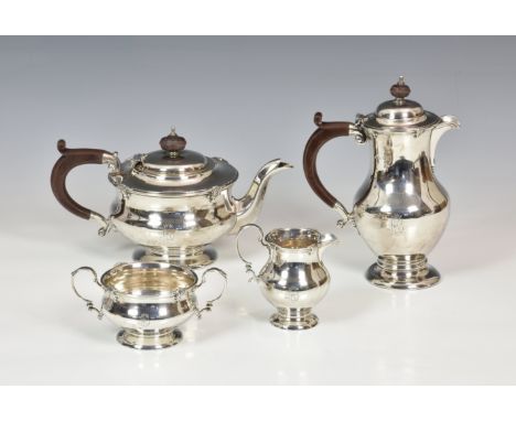 A George V silver four piece tea service, Adie Brothers Ltd., Birmingham 1929, retailed by Finnigans Ltd., comprising a teapo