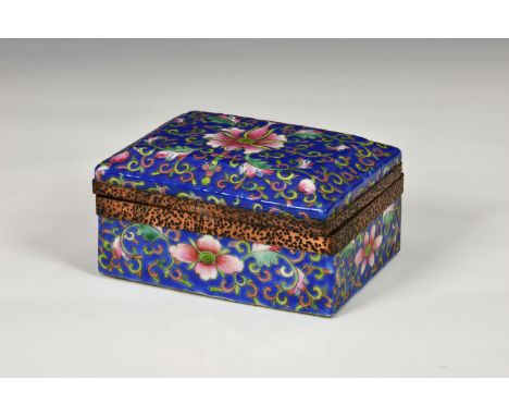 A Chinese porcelain trinket box or jewellery casket, of rectangular form, decorated with floral and foliate design on blue gr