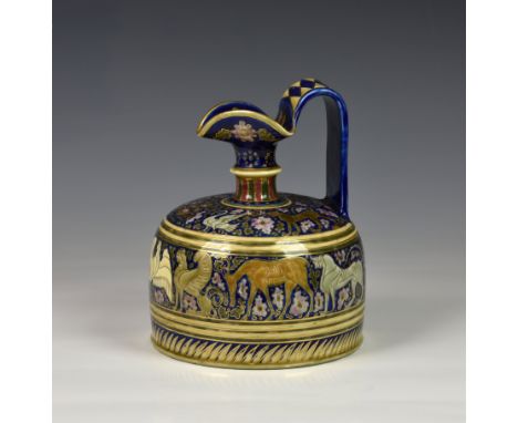 An unusual Hungarian Zsolnay Pecs water jug or ewer, of squat cylindrical form with tricorn spout and loop handle, decorated 