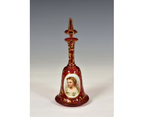 A 19th century Bohemian overlaid and flash cut ruby glass portrait scent bottle, of hand bell form, with an applied miniature