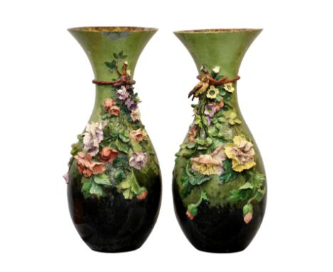 A pair of monumental French majolica Barbotine vases, 19th century, baluster form, each decorated with a cord tied spray of f
