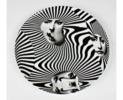 Fornasetti - a Modernist porcelain plate, limited edition no. 312, the white plate featuring a contrasting black print of a w