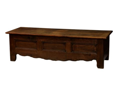 A large French linen chest, 18th century with later alterations, probably oak and chestnut, the lift-off four plank lid over 