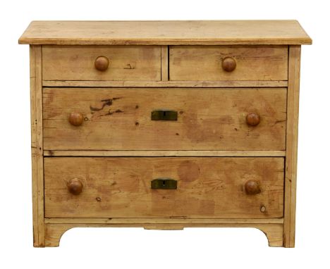 A Continental pine chest of drawers, c.1900, the chamfered top over two short and two long drawers, turned wooden handles, ra