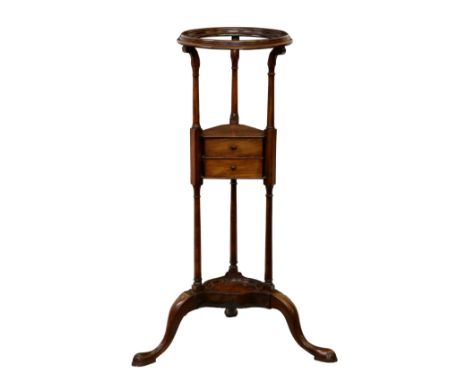 A George III mahogany wig or basin stand, the dished, open top on ring turned supports over a central triangular undertier wi