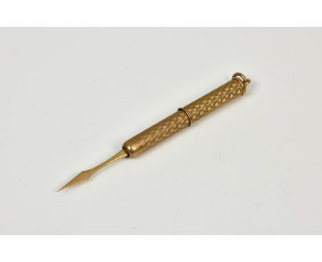 A 9ct gold retractable tooth pick, with engine turned design and hanging loop, weight 6.5 grammes. 