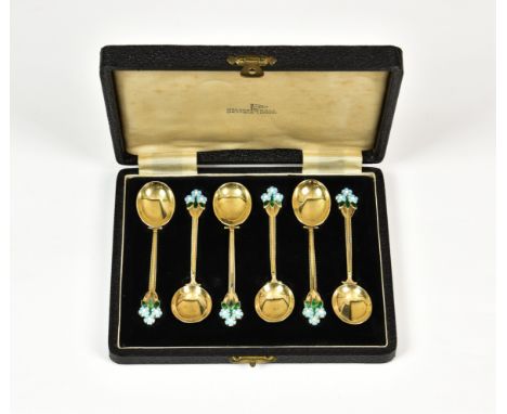 A cased set of six George VI silver gilt and enamel coffee spoons, Walker & Hall, Birm. 1950, with oval bowls and enamelled f