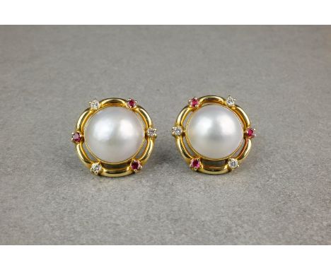 A pair of 18ct gold, ruby, diamond and mabé pearl earrings, featuring a creamy white mabé pearl measuring approximately 17mm 