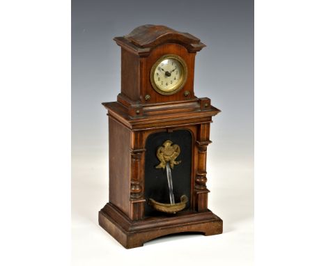 A walnut cased fountain clock by the Hamburg American Clock Company, with crossed arrows mark to the brass single train movem