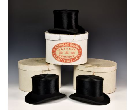 Two boxed moleskin top hats by The Tween Hat Company, retailed by E P Falle Jersey, together with a further boxed top hat by 